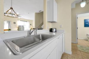 A kitchen or kitchenette at The Regal Palms Resort With Lazy River and Arcade Games
