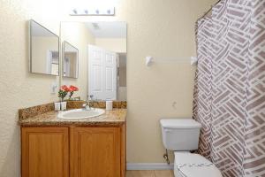 A bathroom at The Regal Palms Resort With Lazy River and Arcade Games