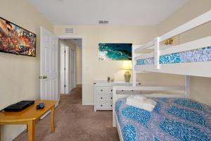 A bed or beds in a room at The Regal Palms Resort With Lazy River and Arcade Games