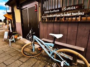 a bike parked in front of a building at Nikko Guesthouse Sumica in Nikko