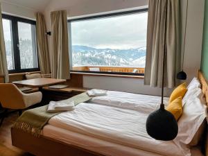 Postel nebo postele na pokoji v ubytování Kaliba Cabins