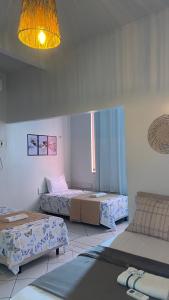 En eller flere senge i et værelse på Hotel Bella Vista