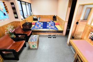 Postel nebo postele na pokoji v ubytování Nikko Guesthouse Sumica