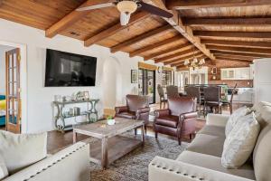 a living room with a couch and a table at Hacienda Buena Vida in Templeton