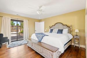 a bedroom with a bed and a ceiling fan at Hacienda Buena Vida in Templeton