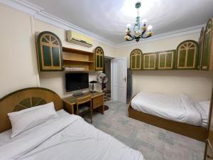 Ένα ή περισσότερα κρεβάτια σε δωμάτιο στο 3 Bedroom apartment with Garden & Office