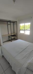 a bedroom with a white bed and a window at 2 Bedroom 1 Bathroom Cabecera del LLano Doorman in Bucaramanga +4 photos