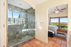a bathroom with a shower with a glass shower stall at Wild Vines in Paso Robles +26 photos