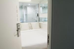 Tempat tidur dalam kamar di Mini Central