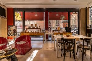 a restaurant with tables and chairs in a room at Patios de San Telmo in Buenos Aires