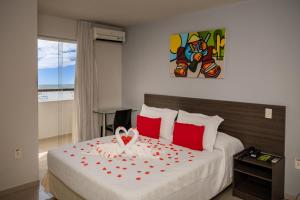 Ένα ή περισσότερα κρεβάτια σε δωμάτιο στο El Aram Ponta Negra +28 φωτογραφίες