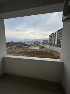 a window in a building with a view of a city at Strumica Jordan Luxury apartments in Strumica