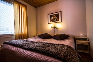 Postel nebo postele na pokoji v ubytování Vuokatti Apartments
