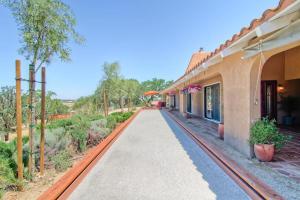 an empty walkway in front of a building at Las Palmas in Templeton