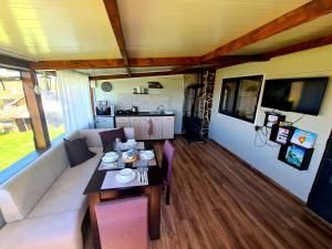 a living room with a couch and a table at Vila Zornica in Kondolovo