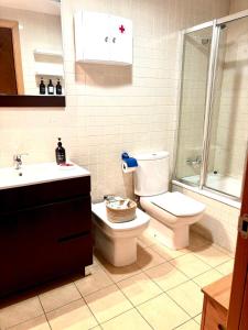 a bathroom with a toilet and a sink at APARTAMENTO L AÜT in Pla de l'Ermita +18 photos