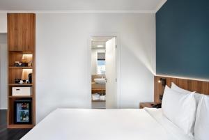 Cama ou camas em um quarto em INNSiDE by Meliá São Paulo ITAIM