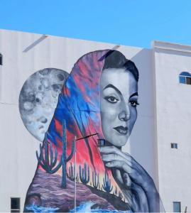 a mural of a woman on the side of a building at Casa Maria Boutique Hotel in San Carlos