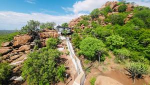 an aerial view of a house on a mountain at Makgobelo Lodge-The Glass House- Solar powered in Ga-Mokalapa +16 photos