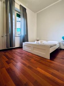 A bed or beds in a room at Castelnuovo Rooms #Politeama