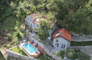 an aerial view of a house with a swimming pool at Villa nel verde con vista mare, Rapallo in Rapallo