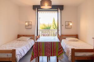 Postel nebo postele na pokoji v ubytování Appartement avec Balcon proche des thermes