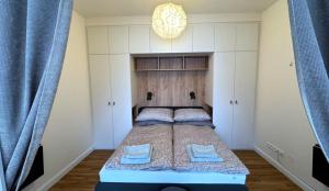 Postel nebo postele na pokoji v ubytování Short Way Apartments