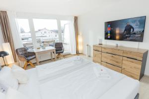 TV a/nebo společenská místnost v ubytování Rosenalm Scheidegg