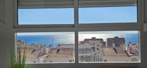 a view of a city from a window at CostaBlanca Sunrise in Arenales del Sol