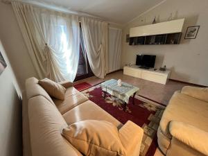 a living room with a couch and a table at La Fabiola in Langhirano