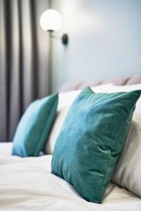 Posteľ alebo postele v izbe v ubytovaní NAVI Residence Erzsebet