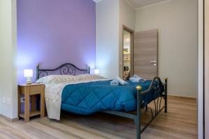 a bedroom with a bed and a desk and a mirror at "A casa dei Nonni" House near the metro C in Rome