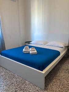 A bed or beds in a room at Mamamia #Politeama