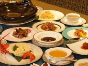 a table topped with plates of food and bowls of soup at YAMANO RESORT HOTEL EIGHE - Vacation STAY 20058v in Shiozawa +7 photos