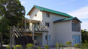 a large white house with a green roof at Playa y Bosque en Santa Clara MDP - Casona de Tipantú - Dúplex B in Camet Norte