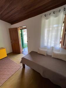 Postel nebo postele na pokoji v ubytování Caju com Mel