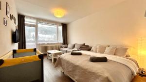 Postel nebo postele na pokoji v ubytování Apartmán Amálka pod Tanvaldským Špičákem