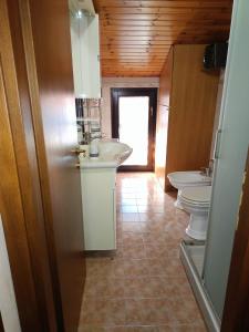 Koupelna v ubytování Ta maison e Ta maison oro