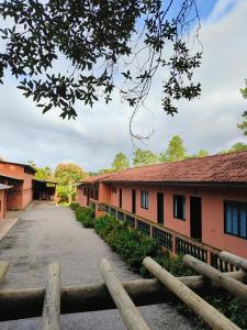 a building with a pathway in front of it at Paineiras Pousada Rural in Ibiúna
