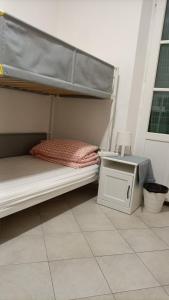 Una cama o camas en una habitación de Mimi family