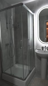 a bathroom with a shower and a sink at Astera 2 in Vrnjci