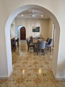 a dining room with a table and chairs at Casa Victoria Cozumel in Cozumel +28 photos