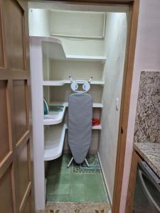 a small closet with a chair in a room at Casa Victoria Cozumel in Cozumel