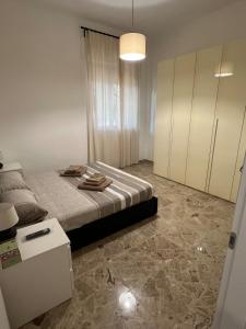 Postel nebo postele na pokoji v ubytování Casa vacanza Athena