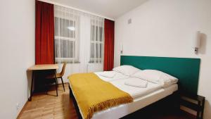 Ένα ή περισσότερα κρεβάτια σε δωμάτιο στο Korona Rooms