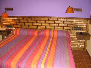 Postel nebo postele na pokoji v ubytování Hostal Xaloa Orio