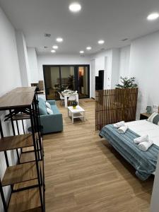 En eller flere senge i et værelse på Apartamento playa malvarrosa