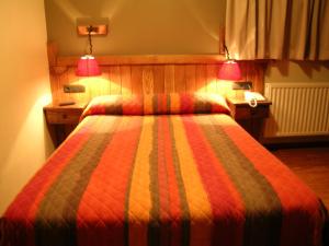 Postel nebo postele na pokoji v ubytování Hostal Xaloa Orio