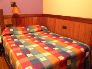 Postel nebo postele na pokoji v ubytování Hostal Xaloa Orio