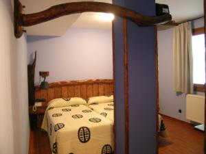 Postel nebo postele na pokoji v ubytování Hostal Xaloa Orio